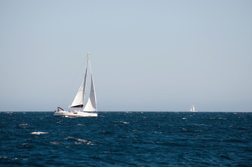 yacht sailing on the sea with clear blue sky