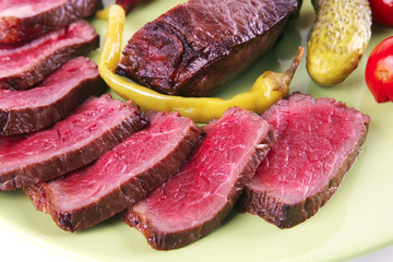 red beef slices on green dish