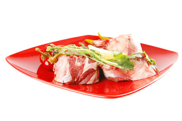 raw beef medallion on red