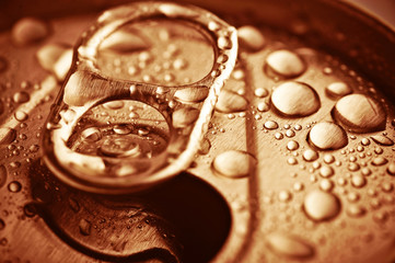 close up opened jar with water drops