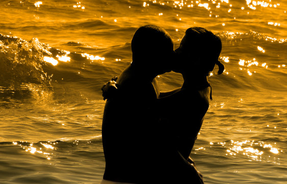 couple on the beach at sunset