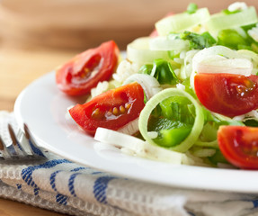 Close-up of rice salad with cherry tomatoes,pepper and basil