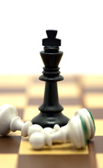 black king and three white pawns