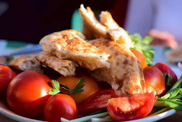 tomato, pita and greens