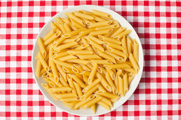 pasta in plate on picnic tablecloth