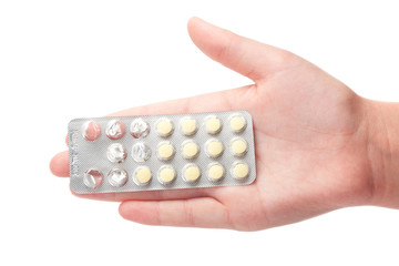 medical pills container on a female hand, isolated