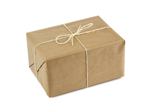 brown parcel tied up with string isolated on white