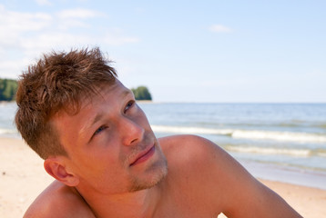 Portrait of the young man on the sea