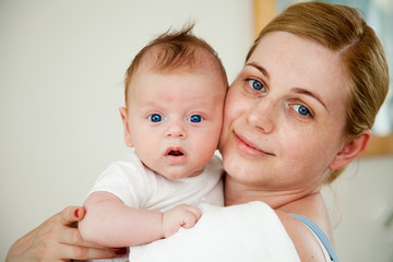 Mother holding her newborn son
