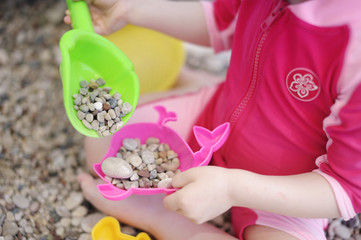 Toddler playing on a beach