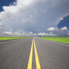 empty country road pass through the storm and cloud