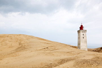 Fototapeta na wymiar Lighthouse and sand dune