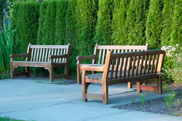 Three empty park benches