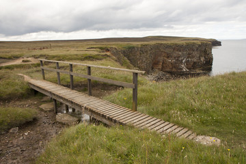 Fototapeta na wymiar Wooden bridge at Orkney islands