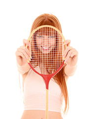 Beautiful woman with tennis racket isolated on white