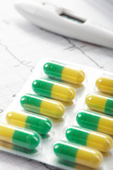 pills on the cardiogram