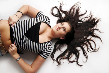 Naklejka premium Atractive brunette in striped black and white T-shirt