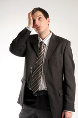 Young worried manager in black suit