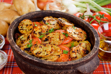 Potato slices baked in clay pot