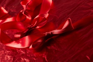 satin ribbons on the red background