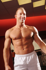 Fototapeta premium The man in fitness centre