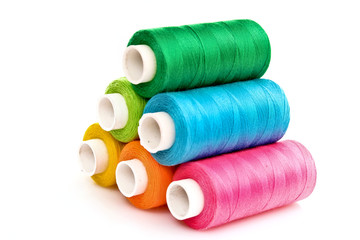 Few bobbins isolated on white