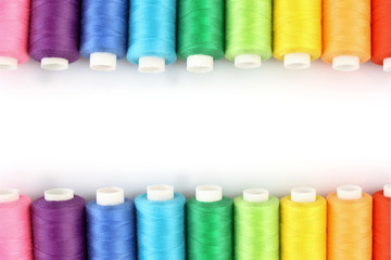 Few bobbins isolated on white