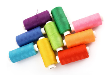 Few bobbins isolated on white