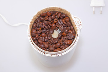 Coffee beans in a grinder