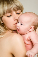 Happy mother with newborn baby