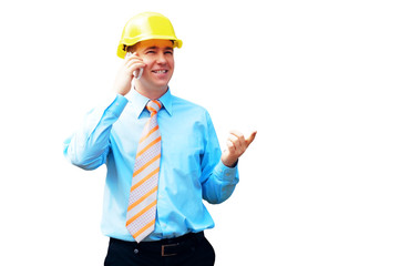 Young architect wearing a protective helmet standing on the buil