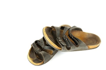 Worn out slipper - isolated over white