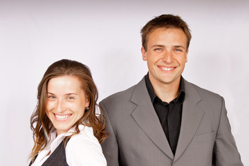 Smiling young businessman with young businesswoman