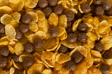 Cornflakes and cocoa balls background.