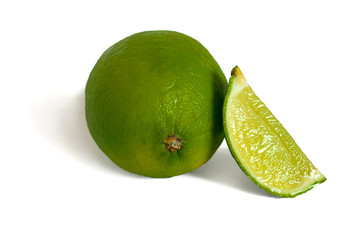 Lime and lime slice isolated on white.