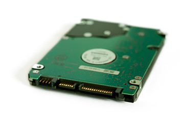 Hard drive closeup isolated on white. Focus on connectors.