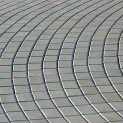 Obraz premium Grey Cobblestone Pavement Texture, Radial Pattern Perspective, Detailed Closeup