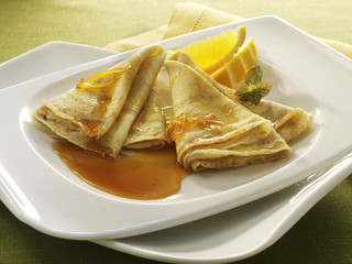 Crepe Suzette on white plate.