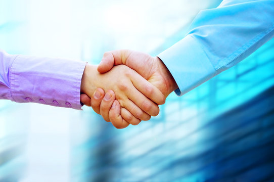 Shaking hands of two business people