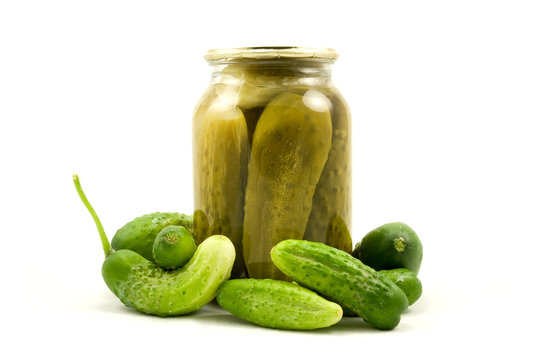 Glass jar with cucumbers on a white background