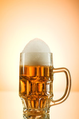 Beer glasses against the colorful gradient background