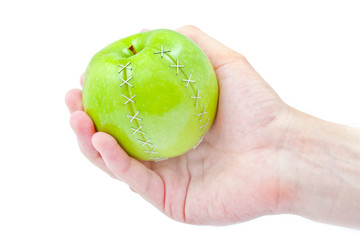 green apple in a masculine hand