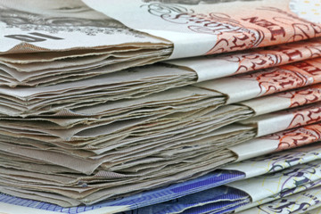 close up pile of pound notes
