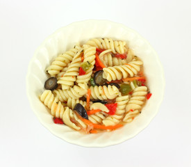 Rotini pasta salad in a small white dish