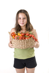 girl holdin a basket of tomatoes