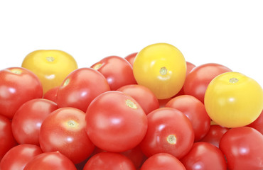 Red and yellow cocktail tomatoes isolated on white