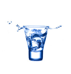 Splash water in glass isolated on white background