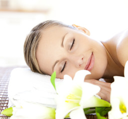 Obraz na płótnie Canvas Relaxed woman lying on a massage table