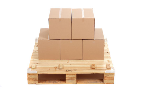 cardboard boxes on wooden palette