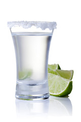 shot glass filled with clear cold alcohol